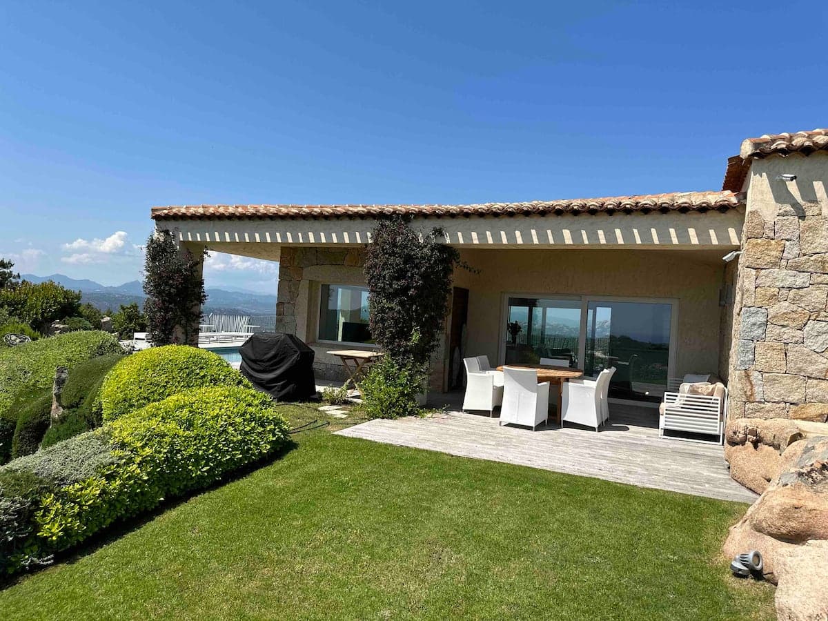 Villa Horizon's stone facade and outdoor dining terrace on arrival